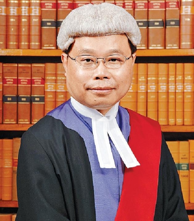 區院法官陳廣池。
